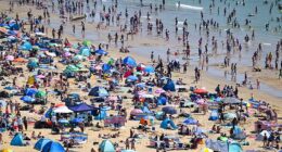 Visitors flock to the beach in Bournemouth today on the hottest May bank holiday on record