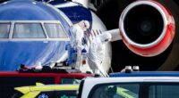 Forensics are seen leaving an aircraft after a patient was evacuated at Schiphol-East. According to the Ministry of Foreign Affairs, three medical evacuees from the cruise ship MV Hondius were on board