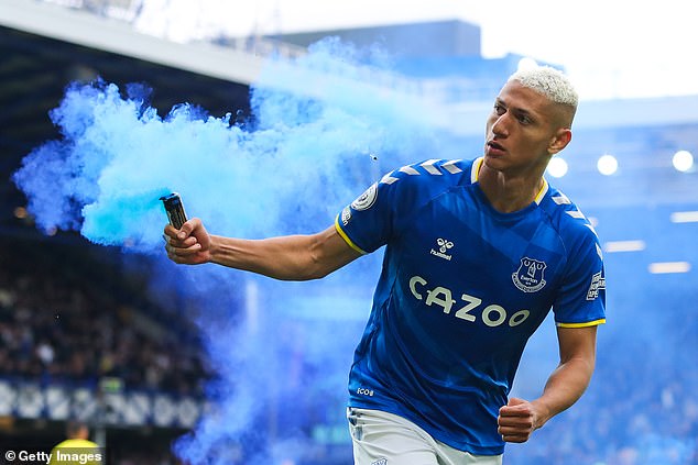 Richarlison brandishes a flare after his crucial goal in Everton's survival fight in 2022