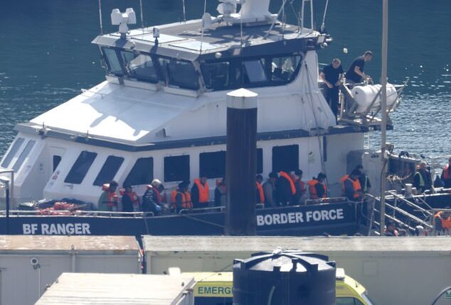 Historic figure: Among the people brought ashore by Border Control yesterday is the man believed to be the 200,000th small-boat migrant