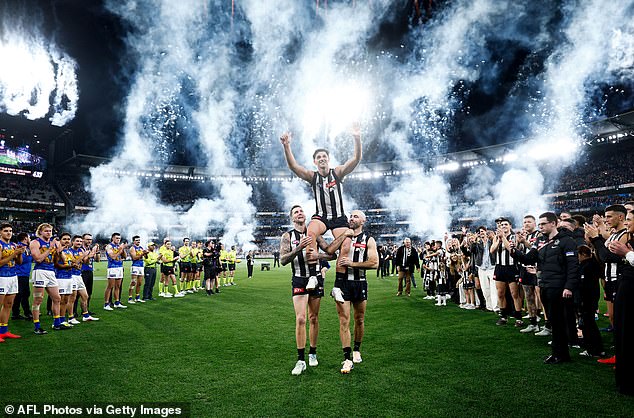 Scott Pendlebury is pictured being chaired off the MCG after breaking the AFL's record for games played on Saturday