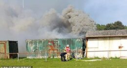 The fathers who were drinking in the club's beer garden climbed on top of the flaming container and helped him out through a small window after a mother heard him wailing