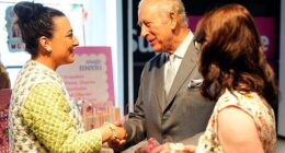 King Charles picked up a special gift for Princess Charlotte from Rachel Rose Accessories in Belfast on Tuesday (pictured: Charles shaking Rachel's hand)