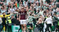 Socceroos star Cameron Devlin (centre) reacts after his Hearts side had a third goal scored on them by Celtic in the match that decided the Scottish Premiership title
