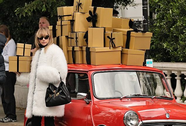 Suki Waterhouse is seen in Notting Hill, filming a Christmas themed photoshoot for Michael Kors