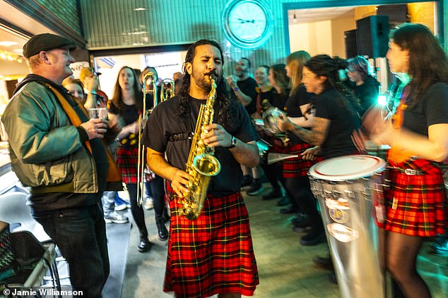 Glasgow band SambaYaBamba perform their World Cup song to an eclectic crowd in Partick