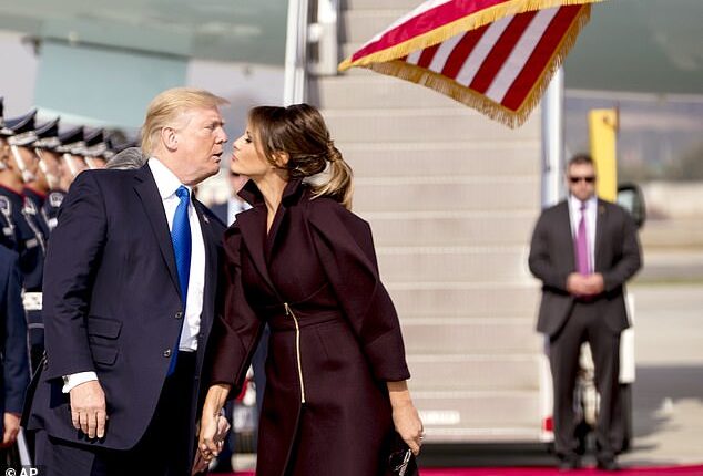 Trump kisses first lady Melania Trump as they arrive at Osan Air Base in Pyeongtaek, South Korea on Nov. 7, 2017. Trump was on a five country trip through Asia traveling to Japan, South Korea, China, Vietnam and the Philippines