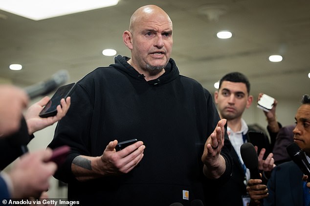 Senator John Fetterman, Democrat of Pennsylvania, speaks to reporters at the Capitol in Washington, DC on March 3, 2026
