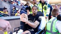 Tottenham's Xavi Simons is carried off the pitch at Molineux after rupturing his ACL