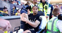 Tottenham's Xavi Simons is carried off the pitch at Molineux after rupturing his ACL