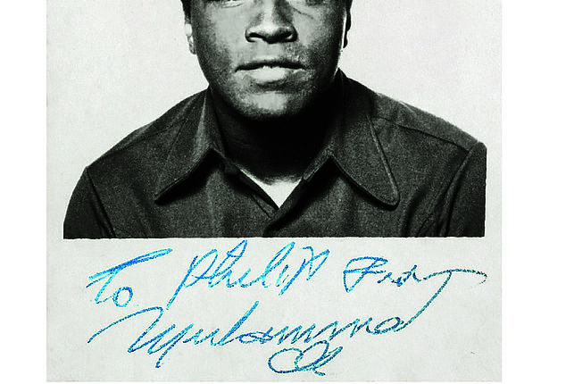 Muhammad Ali is pictured in a passport photo taken by David Sharkey in London
