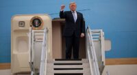 President Donald Trump pumps his fist as he departs Beijing for the United States after spending just under two days on the ground in China meeting with Chinese leader Xi Jinping amid the Iran war
