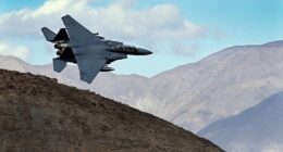 An F-15E Strike Eagle turns toward the Panamint range over Death Valley National Park, California