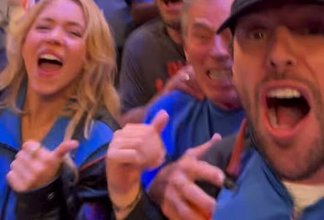 Scooter Braun (R) and Sydney Sweeney (L) were painfully close to coming face-to-face with his nemesis Taylor Swift when they attended game four of the NBA Finals on Wednesday night; they're pictured cheering after the Knicks beat the Spurs 107–106