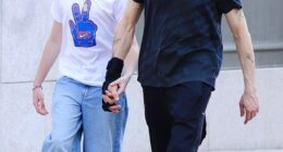 Adrien Brody, 53,  highlighted his close, fatherly relationship with his girlfriend Georgina Chapman's son Dashiell, 13, when they held hands on an outing in New York City on Tuesday