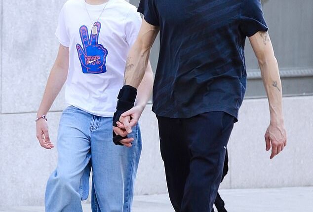 Adrien Brody, 53,  highlighted his close, fatherly relationship with his girlfriend Georgina Chapman's son Dashiell, 13, when they held hands on an outing in New York City on Tuesday