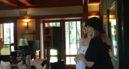 Barbra Streisand has shared a sweet snap cradling Anne Hathaway's growing baby bump after the actress announced she is expecting her third child