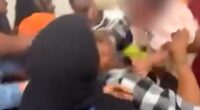 Bare-knuckle brawl breaks out at kindergarten graduation as a BABY is pulled out from the middle of the melee