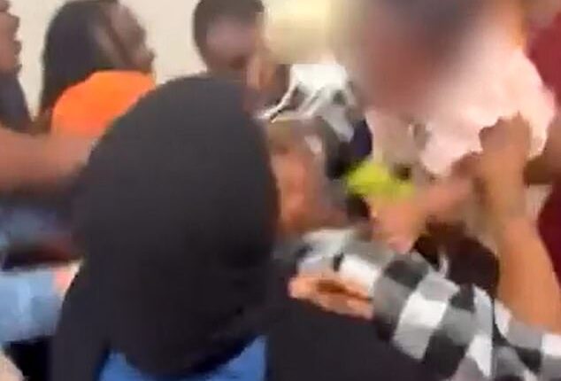 Bare-knuckle brawl breaks out at kindergarten graduation as a BABY is pulled out from the middle of the melee