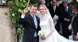 The King's nephew Peter Phillips holds an umbrella above his new wife Harriet Sperling