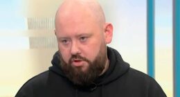 A hero who stopped the alleged knifeman during an attack in Belfast has said intervening was his 'natural reaction' as he condemned rioters and said money raised to support him should go to the victim instead. Maitiu Mág Tighearnán, 32, was seen hitting a man with a hurling stick in a viral video of the assault which left Stephen Ogilvie in a critical condition in hospital. Mr Ogilvie lost his left eye following the attack and suffered injuries to his back, neck and face - including to his right eye - in the attempted 'beheading' at around 10.30pm on Monday. He remains in hospital. Sudanese asylum seeker Hadi Alodid, 30, has since been charged with attempted murder and remanded in custody. The attack on Kinnaird Avenue in the north of the city has led to two nights of anti-immigration rioting in Belfast that has seen homes torched, police officers injured and vehicles set on fire. Speaking to Good Morning Britain this morning, Mr Tighearnán hit out at those bringing violence to the city, saying they have 'lost sight' of what they are protesting for.
