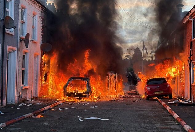 Lendrick Street in east Belfast was engulfed in flames, with multiple cars and at least one house ablaze