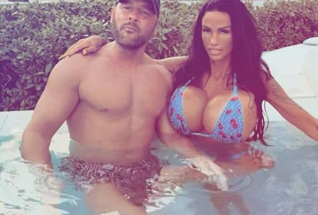 Bikini-clad Katie Price draped herself over Lee Andrews and brandrf them Britain's 'most hated people' - after her husband was accused of scamming 'vulnerable woman' out of £5k