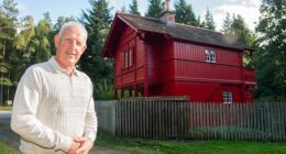 Gordon Christie is seen here next to a Swiss Cottage he restored - which sits alongside the A98 on the outskirts of Fochabers