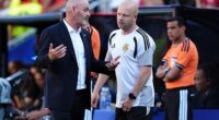 Head coach Steve Clarke consults assistant Steven Naismith during the Morocco match