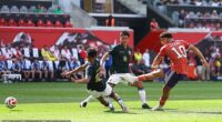 Striker Che Adams scores the second of his goals in Scotland's 4-0 victory against Bolivia