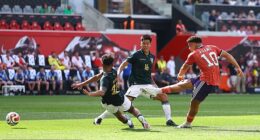 Striker Che Adams scores the second of his goals in Scotland's 4-0 victory against Bolivia