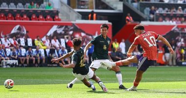 Striker Che Adams scores the second of his goals in Scotland's 4-0 victory against Bolivia