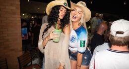 Two female England fans enjoy the party at the Londoner Pub on Mockingbird Lane
