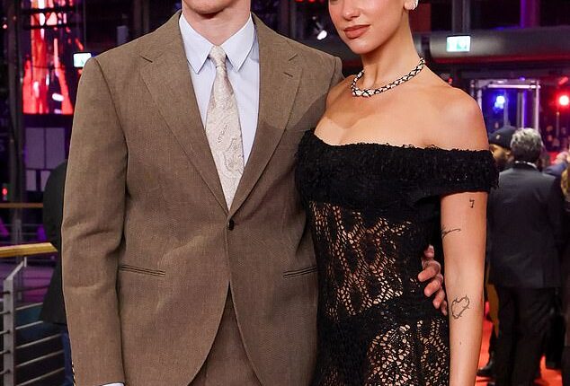 Singer Dua Lipa is back from her honeymoon but she's going to have to wait to be carried over the threshold by Callum Turner, with work on her property predicted to continue until July 2027