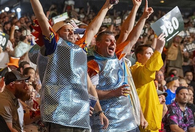 Thousands of England fans have flooded into New York for the team's final group game against Panama. Pictured: Fans enjoy watching darts player Luke Littler at Madison Square Garden