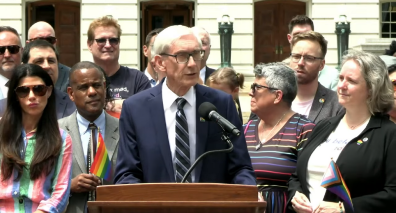 Tony Evers speaking at a gay event.