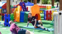 Wayne Rooney stretches out in a children's playground at the 2014 World Cup in Brazil