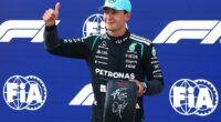 George Russell celebrates putting himself front of the grid in Austria
