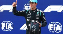 George Russell celebrates putting himself front of the grid in Austria