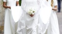 Here comes the bride! Harriet Sperling is the epitome of a bridal beauty in a traditional lace gown and glittering tiara as she arrives at her royal wedding to Peter Phillips alongside guests King Charles and Kate
