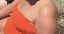 Emily Larner in Greece in 2019, weighing 17-and-a-half stone and wearing her flesh-covering bright orange swimsuit. ¿I felt deeply uncomfortable in my own skin,¿ she says