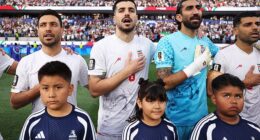 (L-R) Shoja Khalilzadeh, Saeid Ezatolahi, Alireza Beiranvand and Mehdi Taremi of IR Iran line up for the national anthem before the FIFA World Cup 2026 Group G match against New Zealand