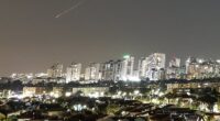 A streak of light illuminates the sky during a missile attack from Iran towards Israel today, as seen from Ashkelon