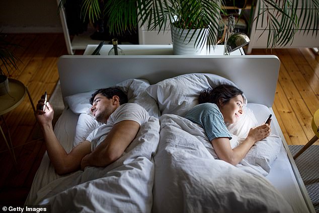 Couples are increasingly likely to escape into their own worlds at bedtime, say relationship experts - with phone use, including 'mindless' browsing, on the rise