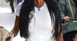 Katie Price has headed back to Dubai with her wedding ring ON as she was pictured at London Gatwick airport on Monday, after her husband Lee Andrews unfollowed her on Instagram