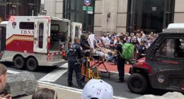 A fan required medical attention from EMTs while waiting for the Knicks' title parade to start