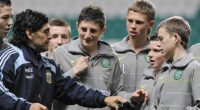 Maradona hands his hat and gloves to young Celtic player Adam Brown after his lucky find