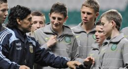 Maradona hands his hat and gloves to young Celtic player Adam Brown after his lucky find
