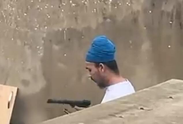 Vickrum Digwa, 23, is filmed as he brandishes the weapon, believed to be an air pistol, around three years before he murdered Henry Nowak