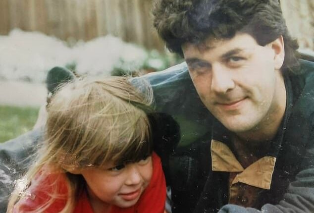 Staring into the camera with his arm wrapped around his three-year-old girl, Garry Hardwicke was the picture of a proud young father